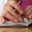 Nice hands with french manicure on the notebook.